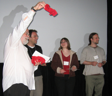 Jim Yorke (University of Maryland) with red sock award winners Daniele Avitabile (University of Surrey), Alethea Barbaro (UC Santa Barbara) and Marshall Hampton (University of Minnesota, Duluth); photograph by Hinke Osinga
