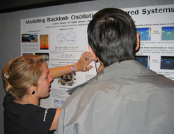 Jo Mason (University of Bristol) explains her award-winning poster; photograph by Hinke Osinga