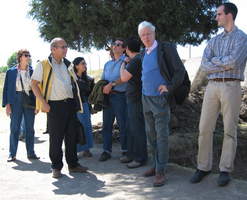 Participants watch others climb one of the pyramids in Cholula.