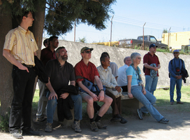 Participants watch others climb one of the pyramids in Cholula.