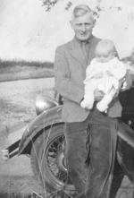 Phil Holmes only a few months old, with his fater in 1945