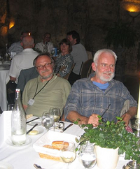 Edgar Knobloch and Phil Holmes at the conference banquet listen to a speech by Gabor Stepan; photograph by Alexander Vladimirsky